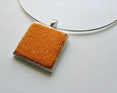 square necklace amber on silvered base - knitted with acrylic wool
