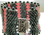 women's nubby beadwoven bracelet in watermelon and caper colors