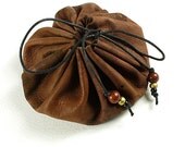 A leather pouch 'medicine bag' with seven crystals