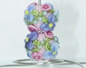 Glass Lampwork Earring beads with purple flowers blue flowers pink rosebuds green leaves and light aqua blossoms