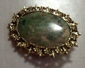 Serpentine Brooch in Goldtone Setting