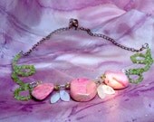 Pretty pink faux stones green beaded necklace.
