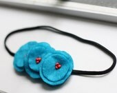 in a whimsical wonderland poppy garland headband.