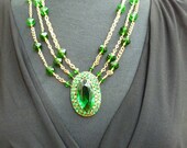 The Emerald Ombre Necklace - Three strands of gold and green with huge emerald green rhinestone vintage pendant and English cut glass beads
