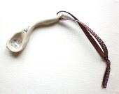 A handmade ceramic wibbly wobbly Love  Spoon