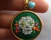 Mexican Day of the Dead Sugar Skull Necklace in Green and Gold Hand Sewn in Cross Stitch