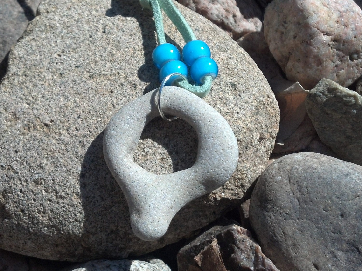 Open Circle Rock Necklace. Mediterranean Beach Stone on soft mint Faux Suede cord OOAK