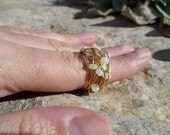 Wrapped Ring. Beads in a Row. The Nebulus. Springtime mints on Merlin's Gold us 7.5