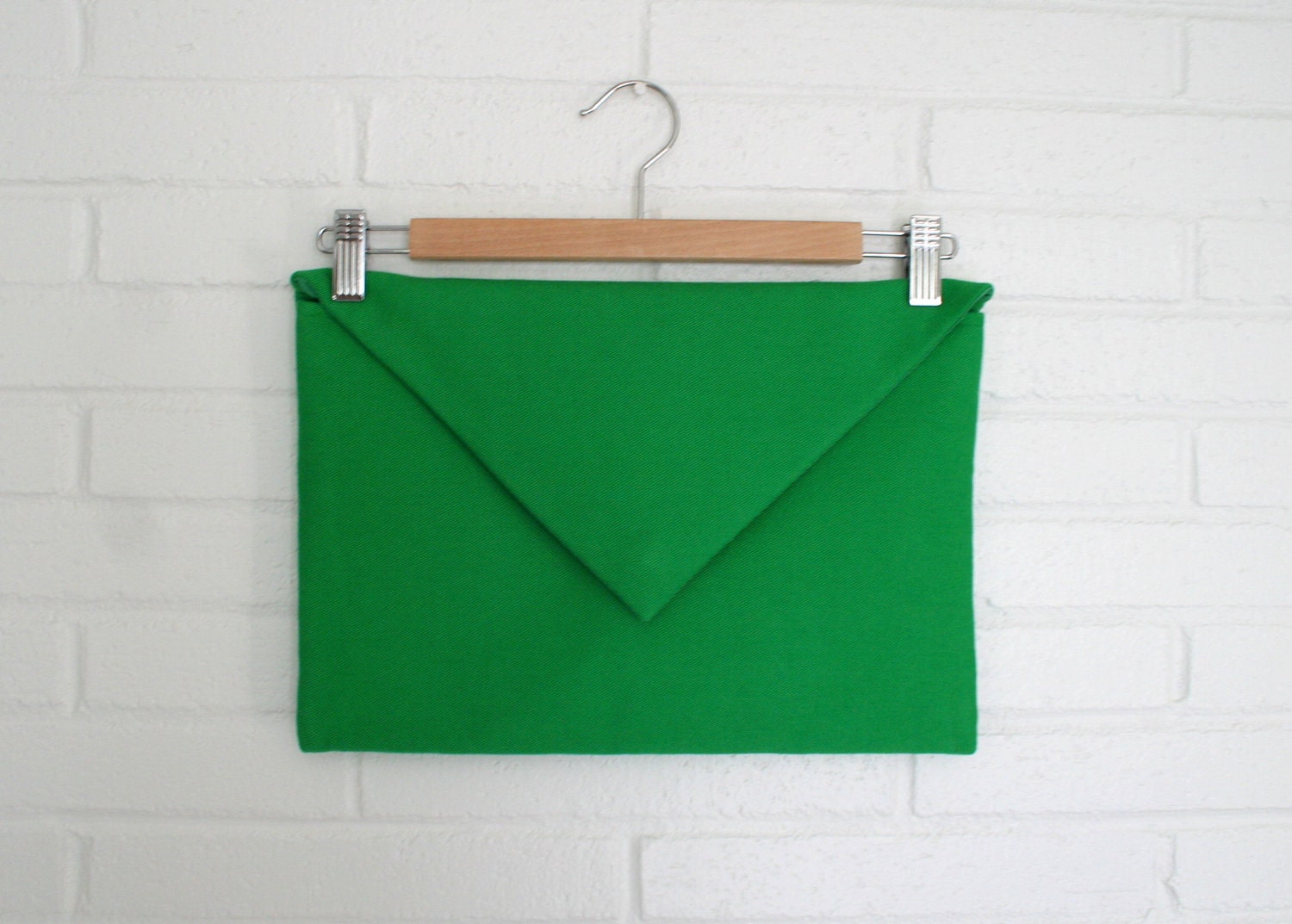 Apple green envelope clutch.