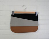 Assymetrical zipper clutch, tan.