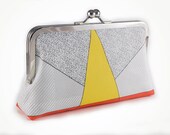 Clutch purse with yellow triangle