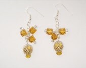 Amber glass beads 6mm diamond cut with amber glass 4x6 mm faceted rondelle beads. Silver netted amber glass hoops.