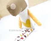 Laura the soft toy sheep with yellow heart