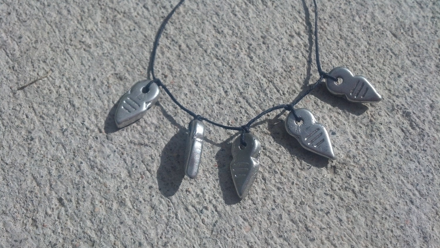 Silver and Navy Necklace.. Silver Czech Glass Feather Arrow Beads on Waxed Linen