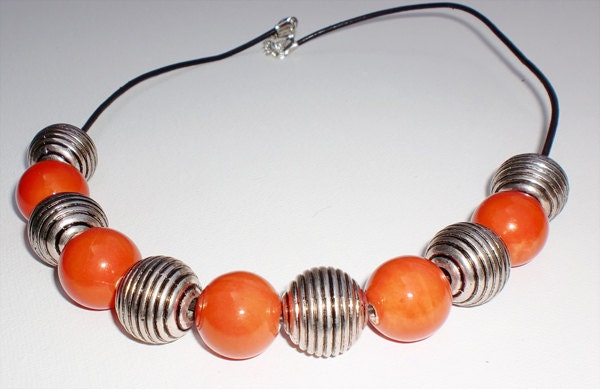 Round orange ceramic bead with round silver metalic necklace