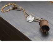 Harbinger of Darkness. Old Rusty bell, crystal quartz, snake bone, and dragon's vein agate unisex talisman