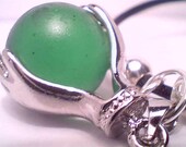 Genuine rare green beach sea glass marble held by hands pendant handmade necklace