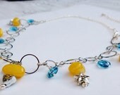 Yellow stone and blue glass bead necklace with star and triangle gold plated beads