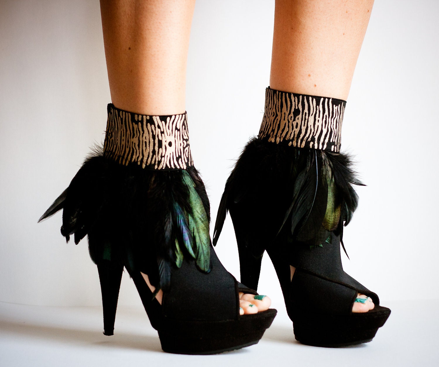CRUELLA Black Feather Ankle Cuffs with Animal Print