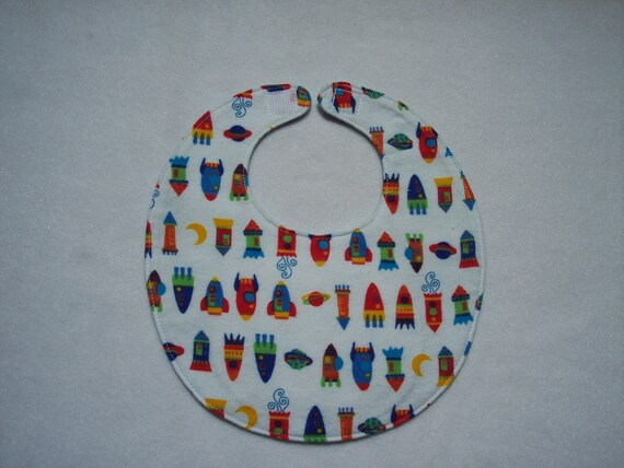 Baby bib, four soft layers, reversible, white with colorful space ships