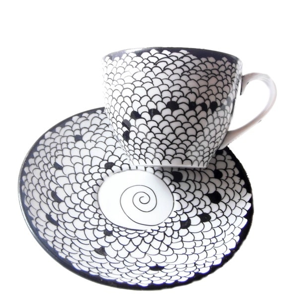 Teacup Hand painted teacup and matching saucer with optical illusion in shape of Honeycomb
