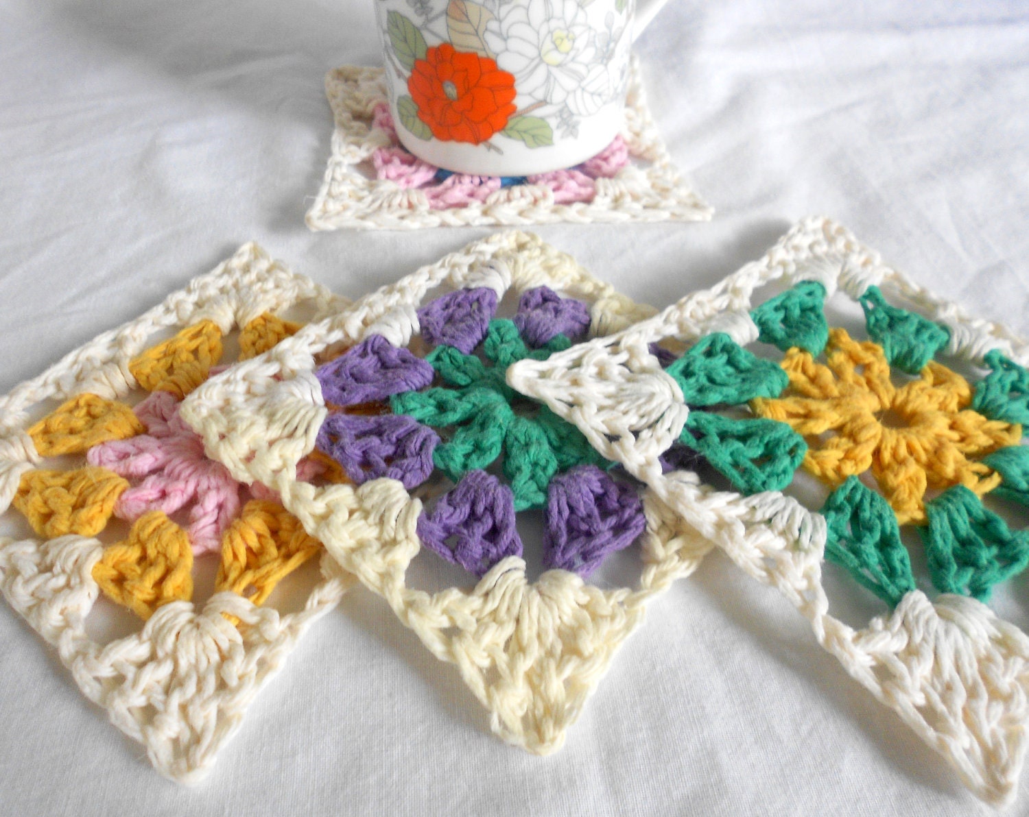 crochet coasters . multi colored. granny chic