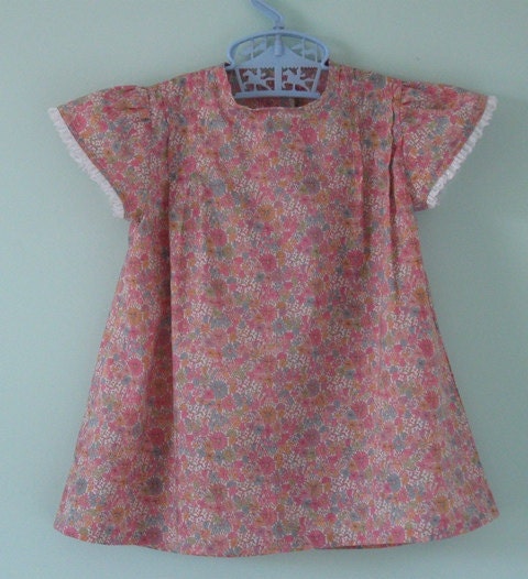 Pretty liberty lawn baby dress. Age 6 months.  Ideal colours for Fall.
