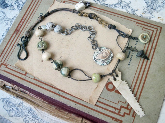 Work is Love. Ceramic rounds and bone saw rustic gypsy assemblage necklace.