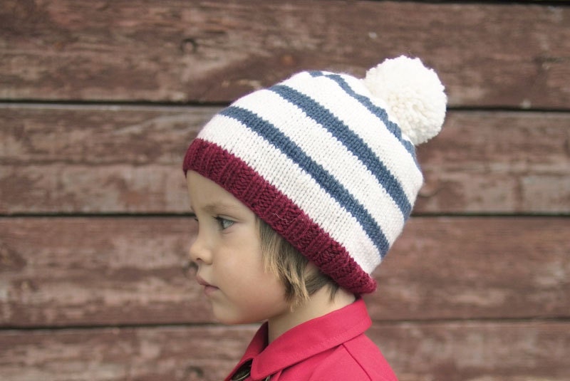 Pom pom striped knit hat for boys and girls.