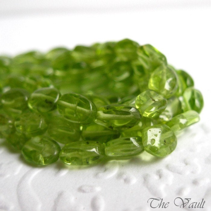 Peridot smooth oval beads, irregular 5-8mm, 14 inch strand