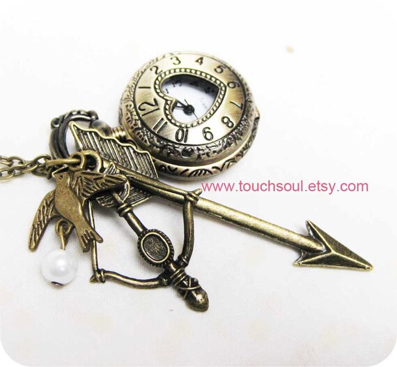The Hunger Games Inspired Arrow,bow, Mockingjay and Peeta Pearl Heart Roman numerals Pocket watch Locket Necklace