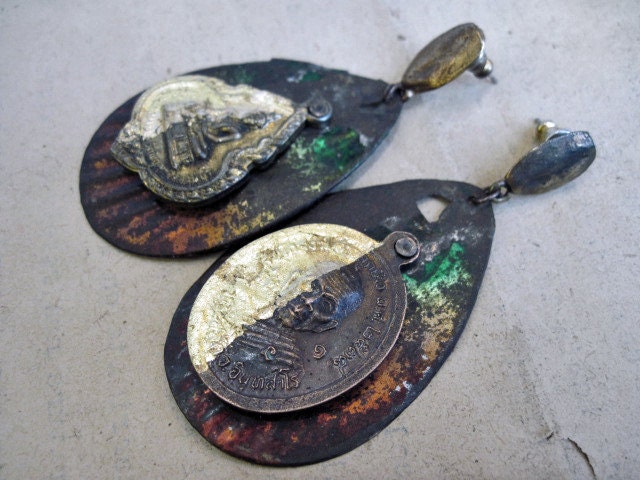 One Black Mystery. Salvaged metal riveted tribal amulets assemblage posts.