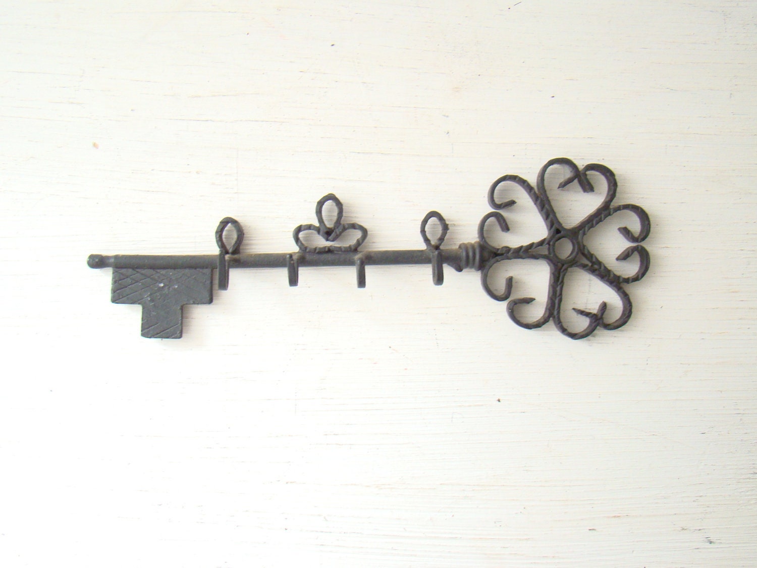 vintage skeleton key shaped key rack painted black with 4 hooks