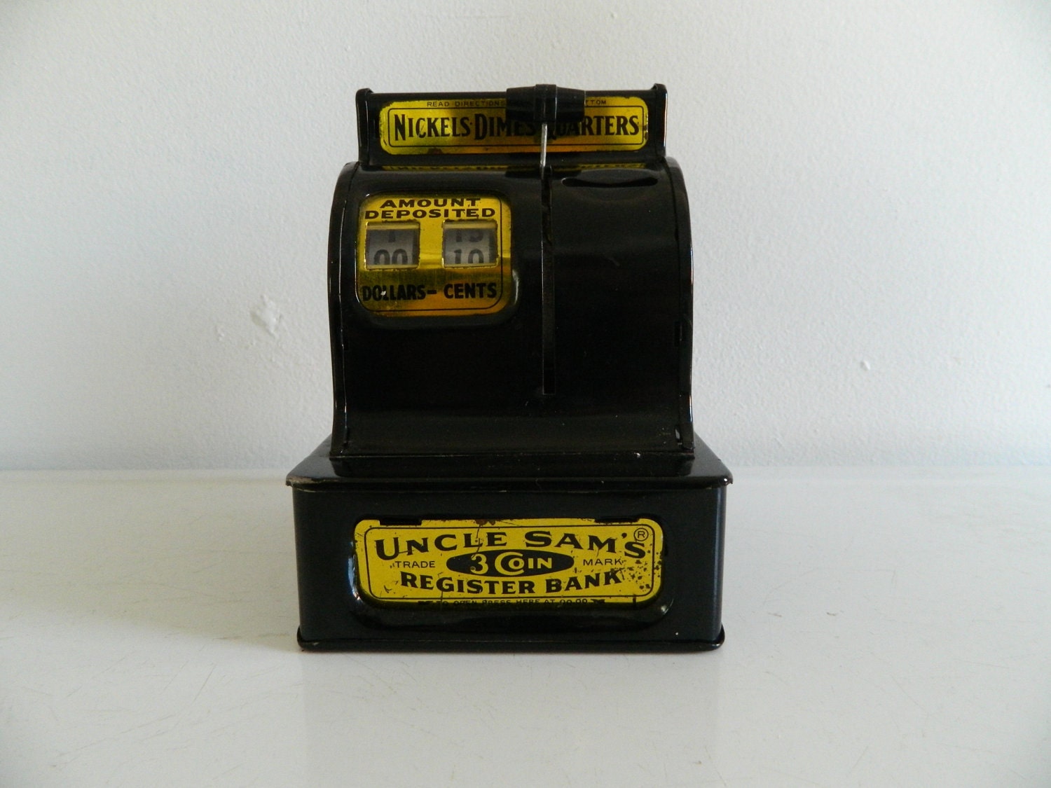 Black vintage coin bank toy