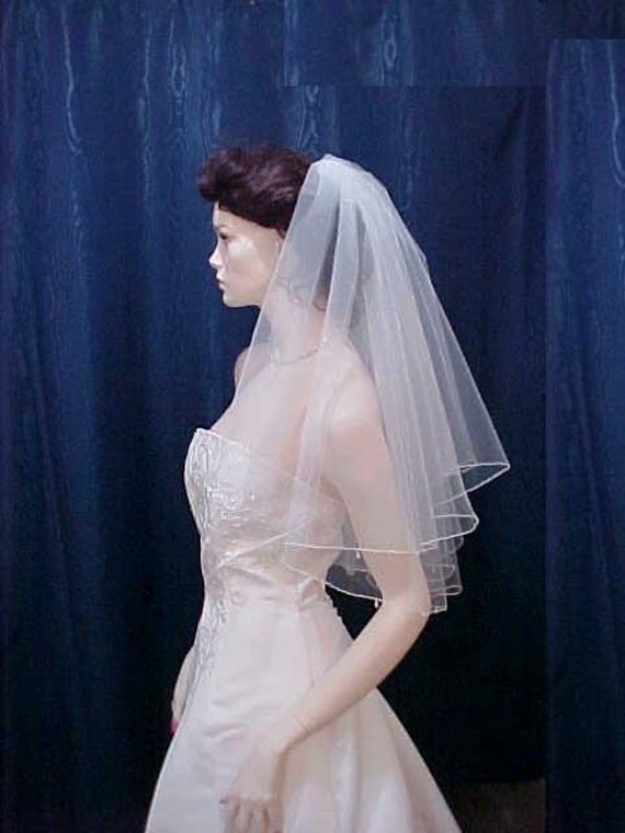 Wedding veil Teardrop Crystals drop from the edge of this Beautiful 2 Tier 