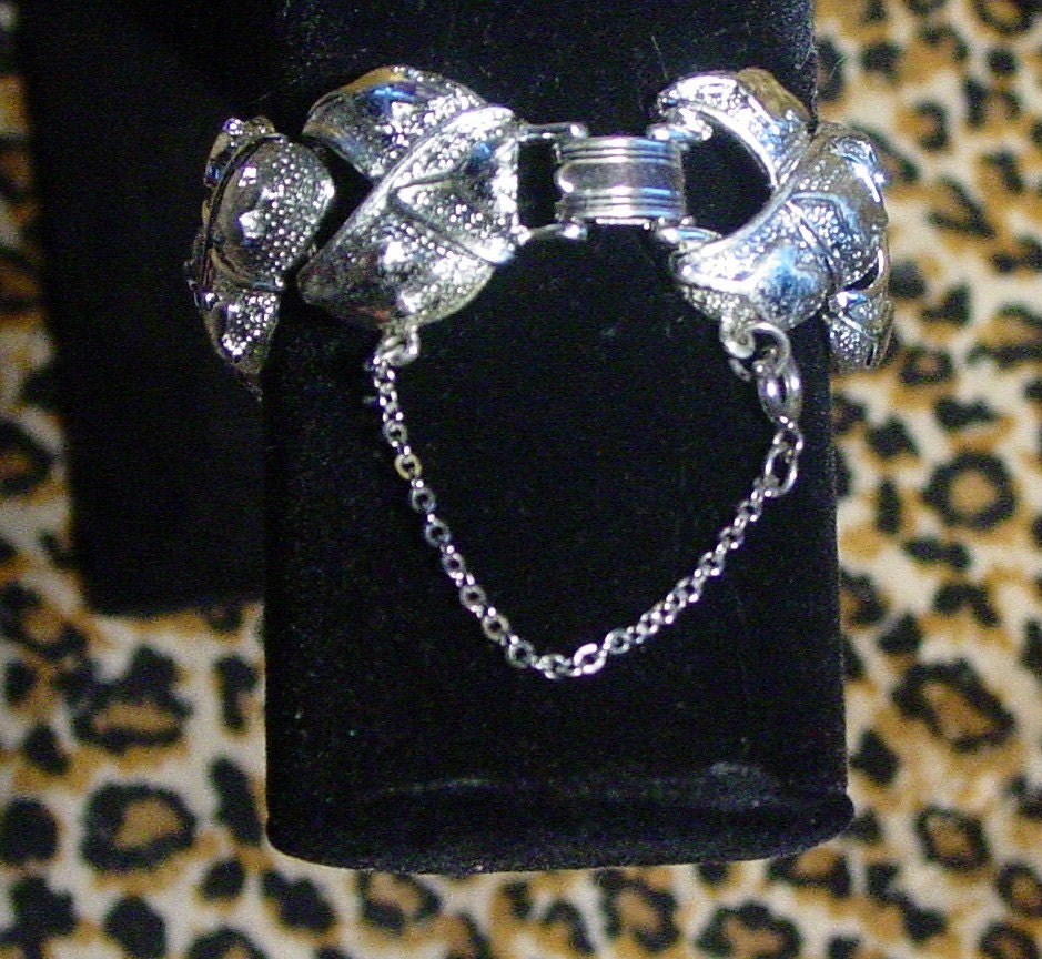 Silver CORO Pegasus U. S. patent pending link bracelet with fold over clasp and safety chain