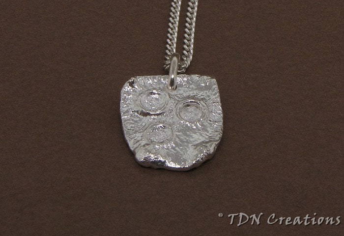 A piece of Planet Mars sterling silver pendant