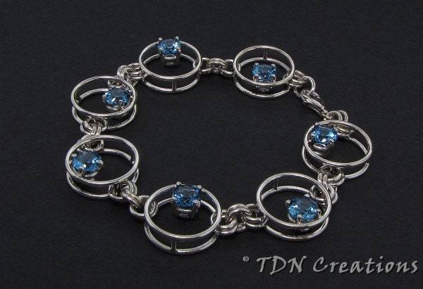 Floating blue topaz sterling silver bracelet