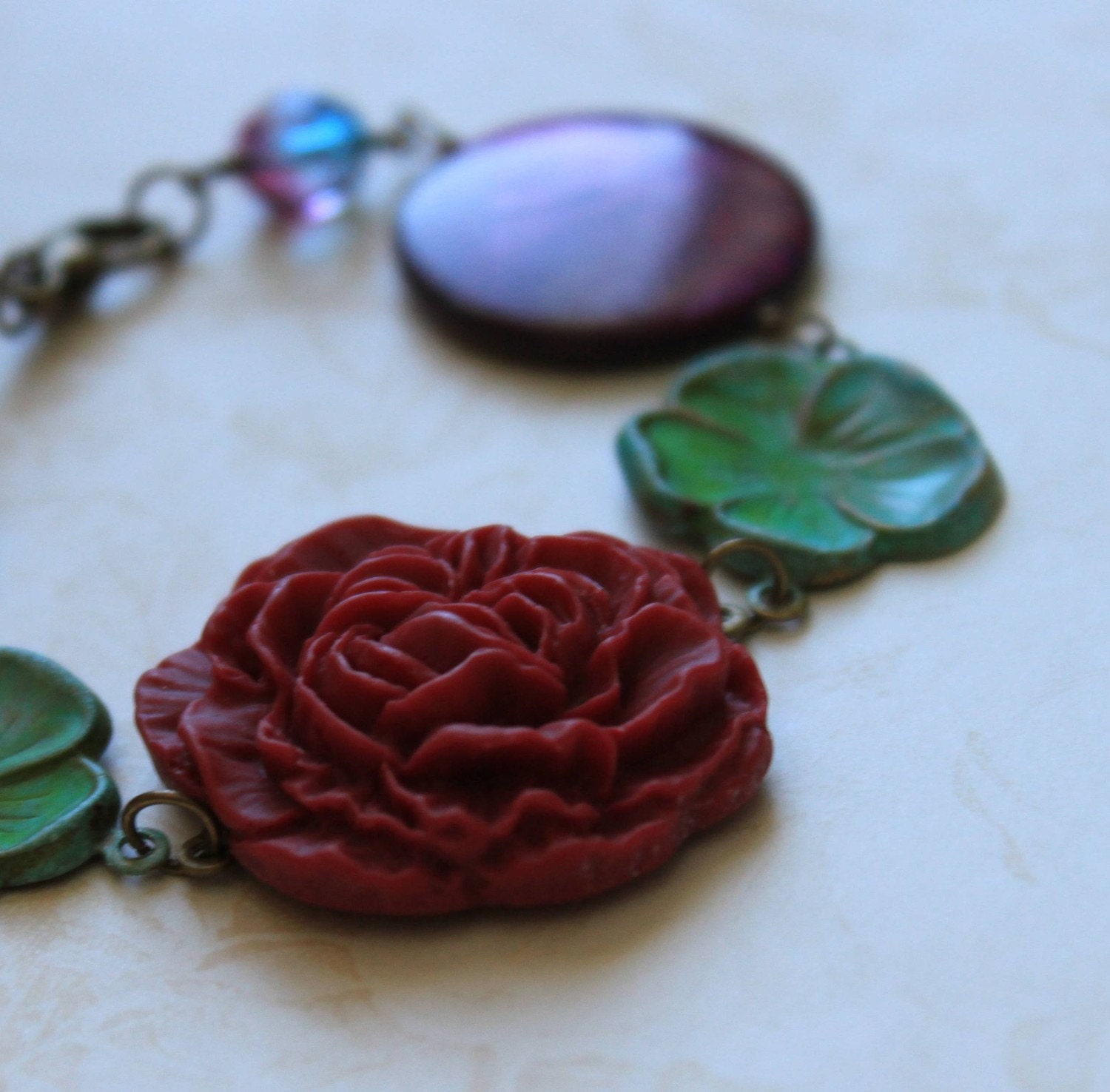 50% off SALE - Beaded Bracelet, Mother of Pearl, Lucite Cabochon, Patinaed Charms, Burgundy, Green, Romantic,