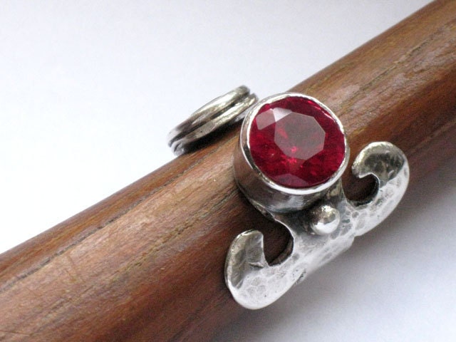 Open ring sterling silver with a facetted Ruby Zircon