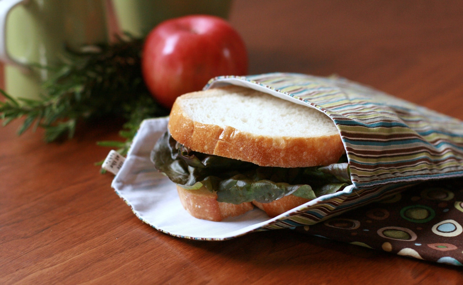 pair of reusable, lined sandwich bags in dinosaur & stripe