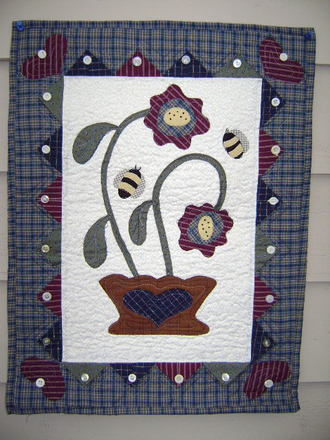 flower basket with bees folk art quilt wallhanging  this quilt measures 18
