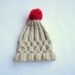 Hand knit cable hat with Rudolph Red Pom Pom