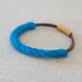 leather cotton and metal bangle