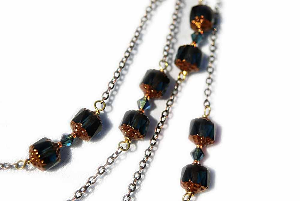 4 Strand 
Czech Cathedral Montana (deep teal), Swarovski Crystal Montana, Saphire 
beads, and Freshwater Pearls with Copper