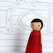 Libby the wood doll in red
