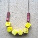 yellow and cranberry geo beaded magnesite necklace
