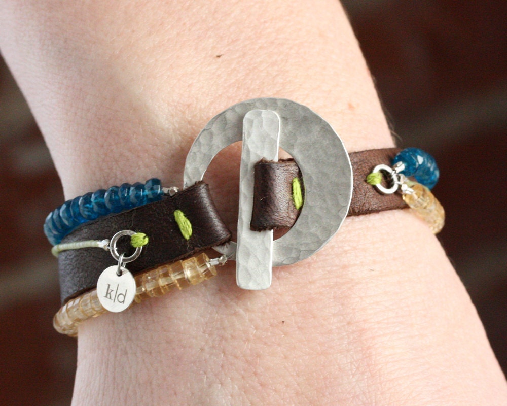 triple strand on deerskin with hammered toggle . bracelet