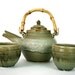 Teapot and tea bowls set with bamboo handle in olive green celedon