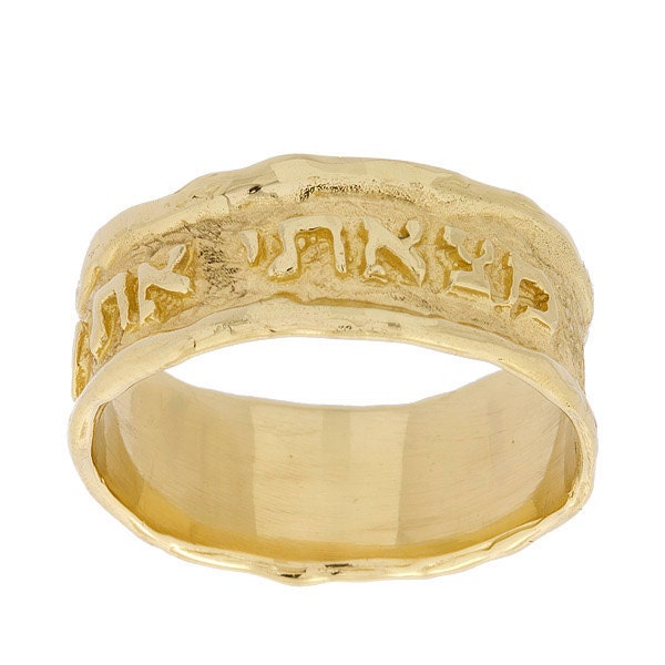Hand crafted in luxurious 14K yellow gold this wide wedding ring features a